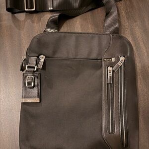Tumi Black Messenger Bag with Sleek Design and Durable Construction